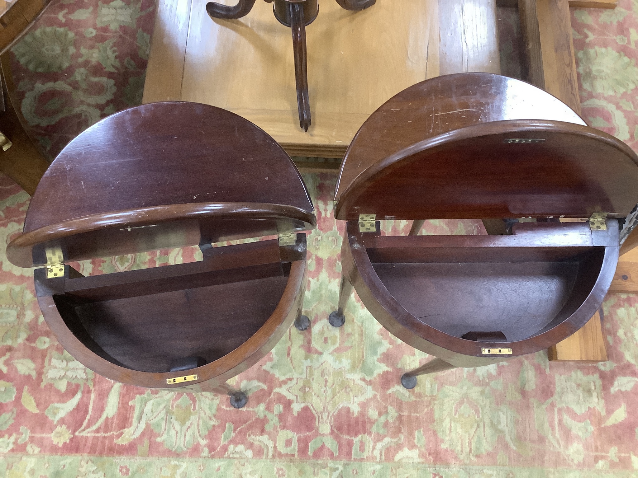 A near pair of small George II style red walnut D shaped folding tea tables, width 45cm, depth 22cm, height 74cm